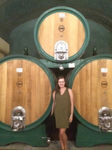 In front of the HUGE barrels of wine!